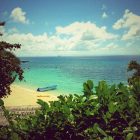 Alegre Beach Resort and Spa's fine white sand beachfront, where aqua sports equipment are available.