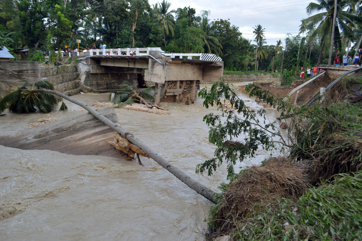 Tropical storm Seniang killed 53 people as it swept across the Visayas and Mindanao from December 29-30 and destroyed the Dumlog Bridge in Sibonga, Cebu. (Photo by Allan Tangcawan)