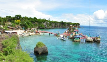 Swim in blue seas, zip or dive from a cliff in Funtastic Island Medellin