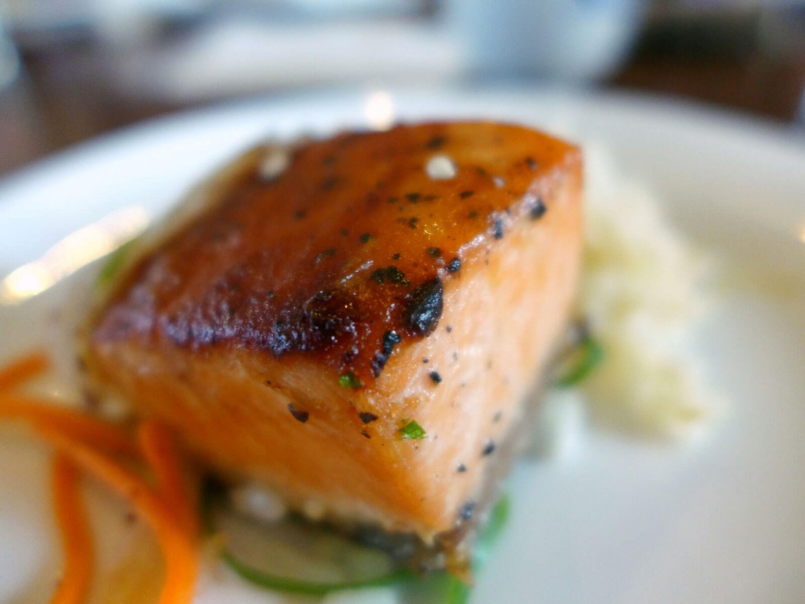 Salmon served with rice pilaf.