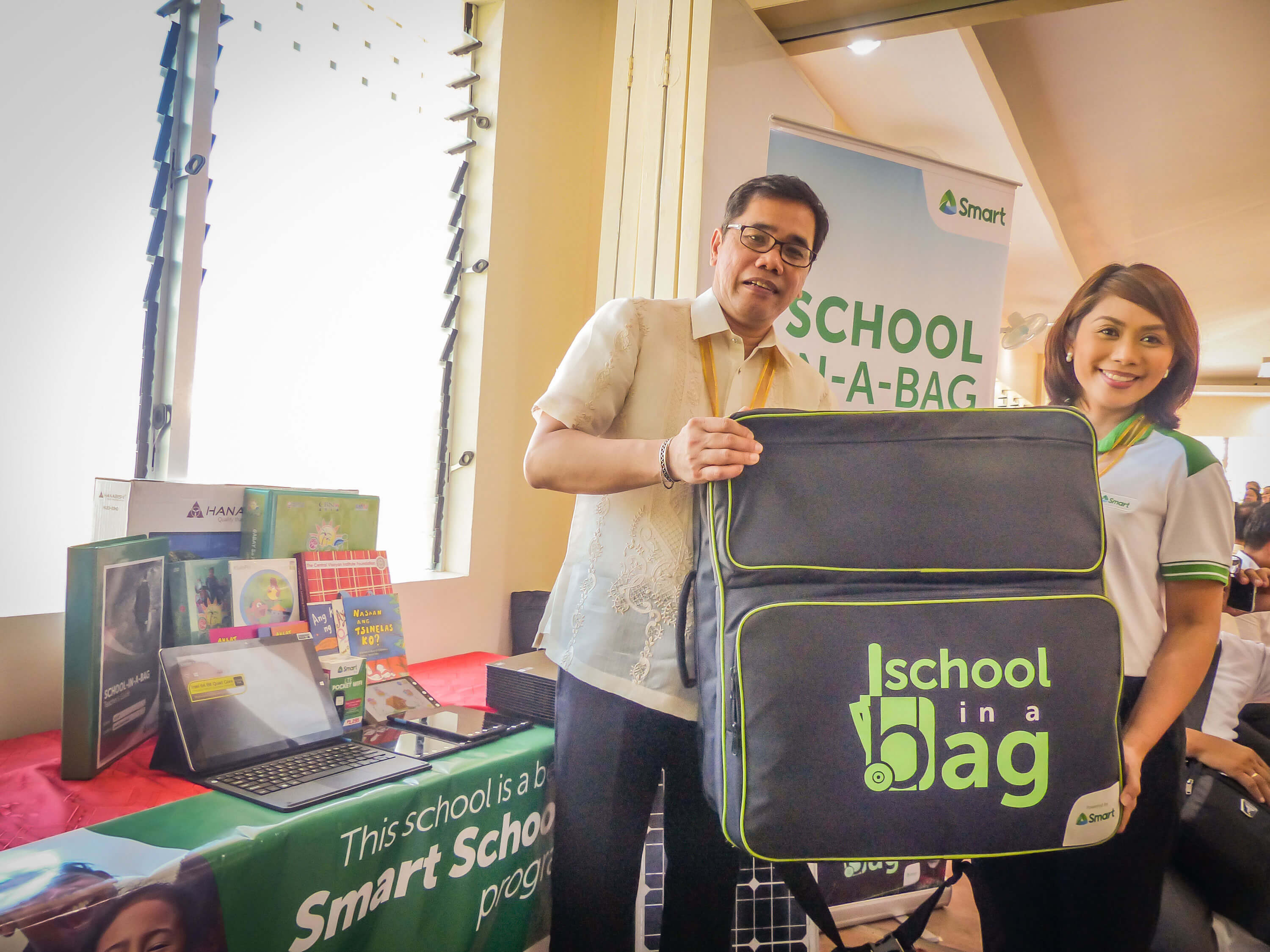DepEd Undersecretary Nepomuceno A. Malaluan with Smart’s Head for Education Programs Stephanie V. Orlino at the inauguration of the pilot Alternative Learning System - Education and Skills Training (ALS-EST) facility in Lawaan, Eastern Samar.