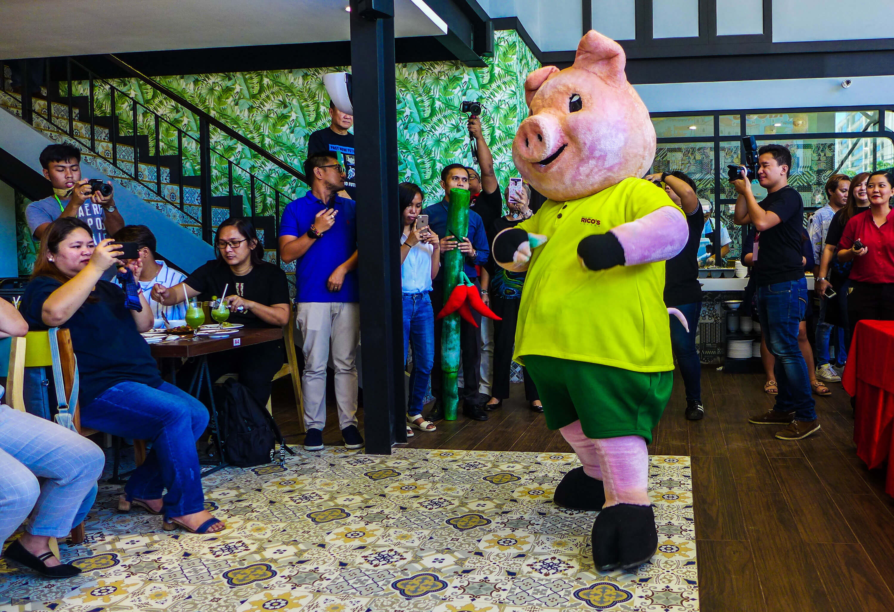 Rico’s Lechon’s mascot entertains bloggers and journalists who covered the media preview.