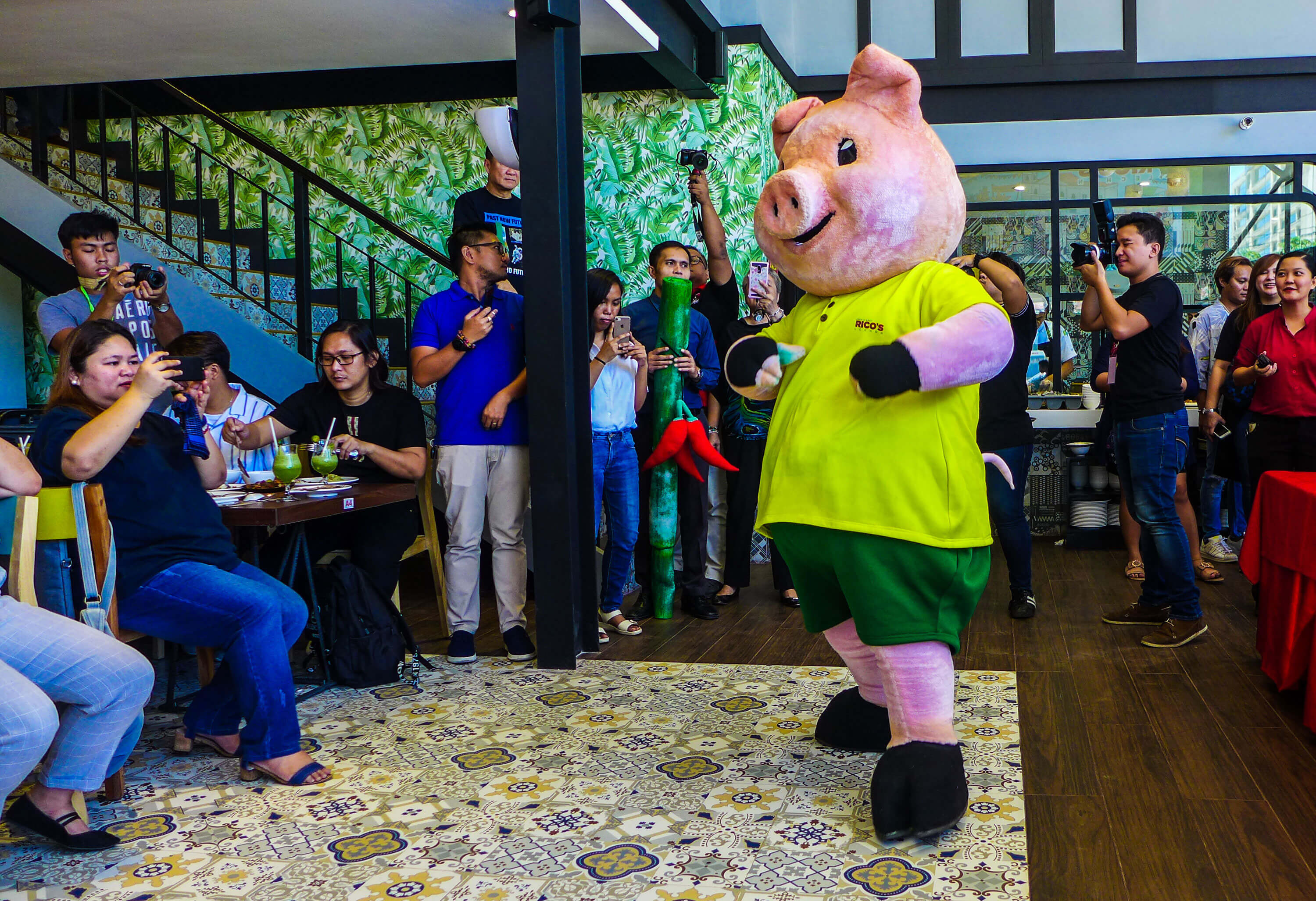 Rico’s Lechon’s mascot entertains bloggers and journalists who covered the media preview.