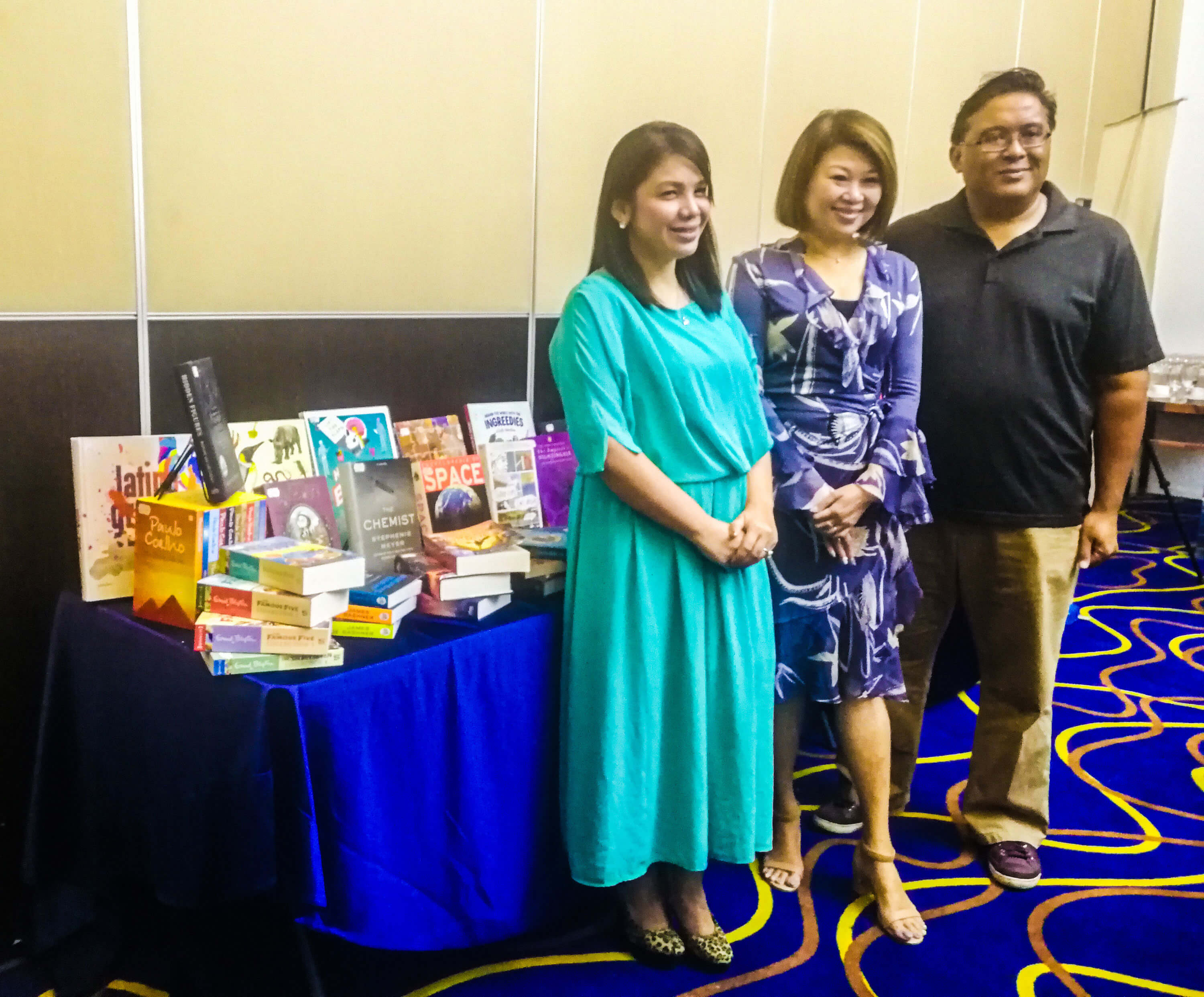 OVER A MILLION BOOKS. Big Bad Wolf Books Philippines Country Manager Narisa dela Peña, founder Jacqueline Ng, and Gawad Kalinga representative Toby Florendo.