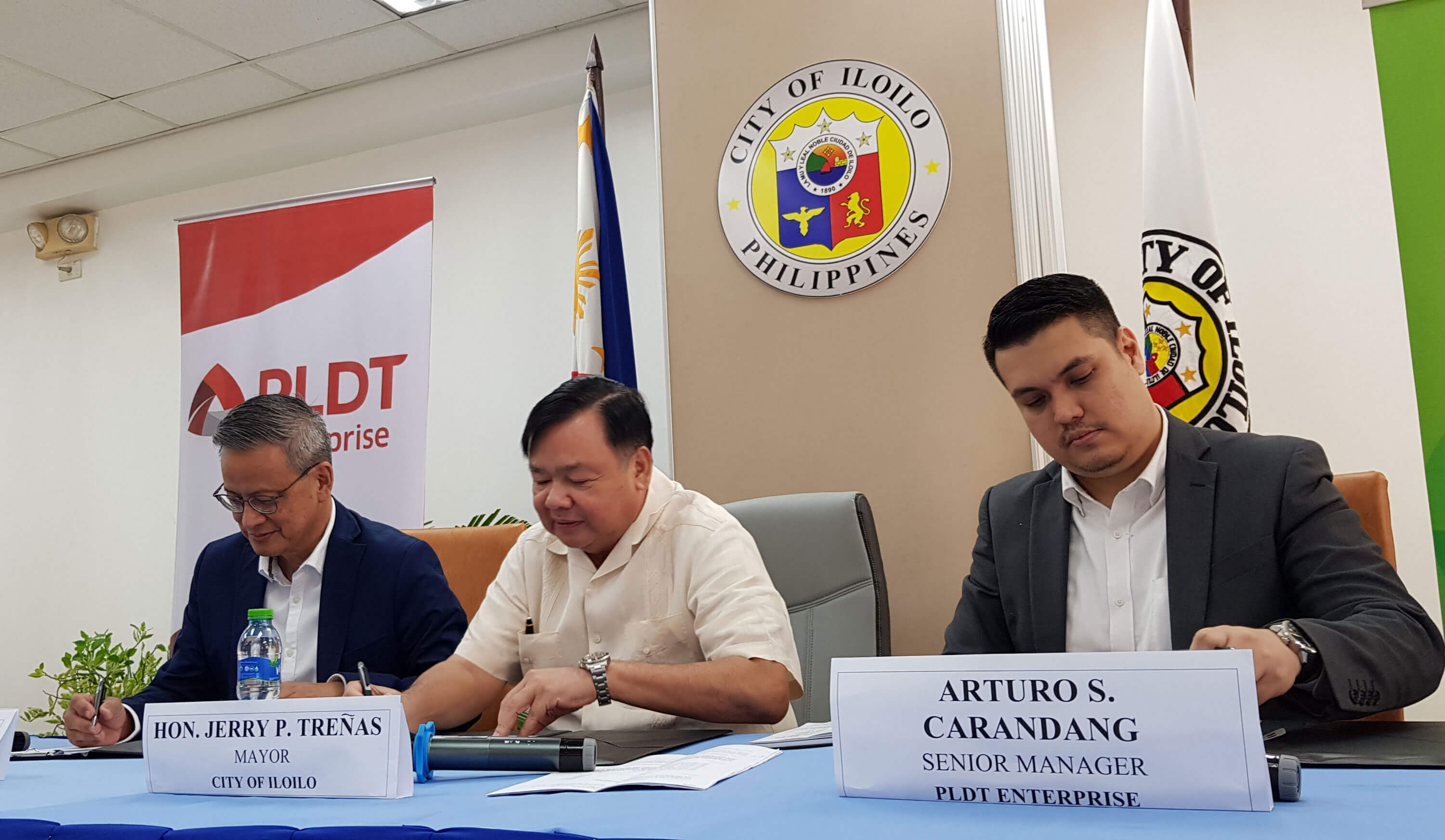 AGREEMENT. Mayor Jerry P. Treñas are joined by PLDT Enterprise One Visayas AVP and Head Jimmy V. Chua and PLDT Enterprise Senior Manager Arturo S. Carandang during the signing of the MOA for Google Station at the Iloilo City Hall.