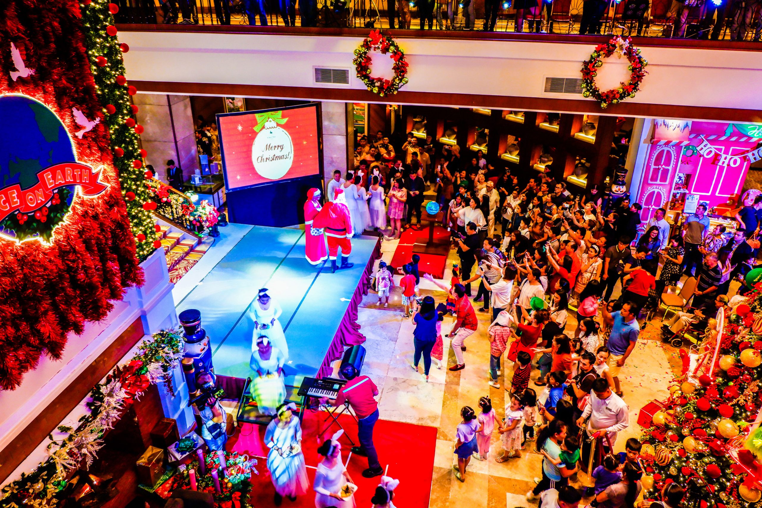 SANTA AND MRS. CLAUS. The most anticipated part of the program for children was the appearance of Santa and Mrs. Claus.