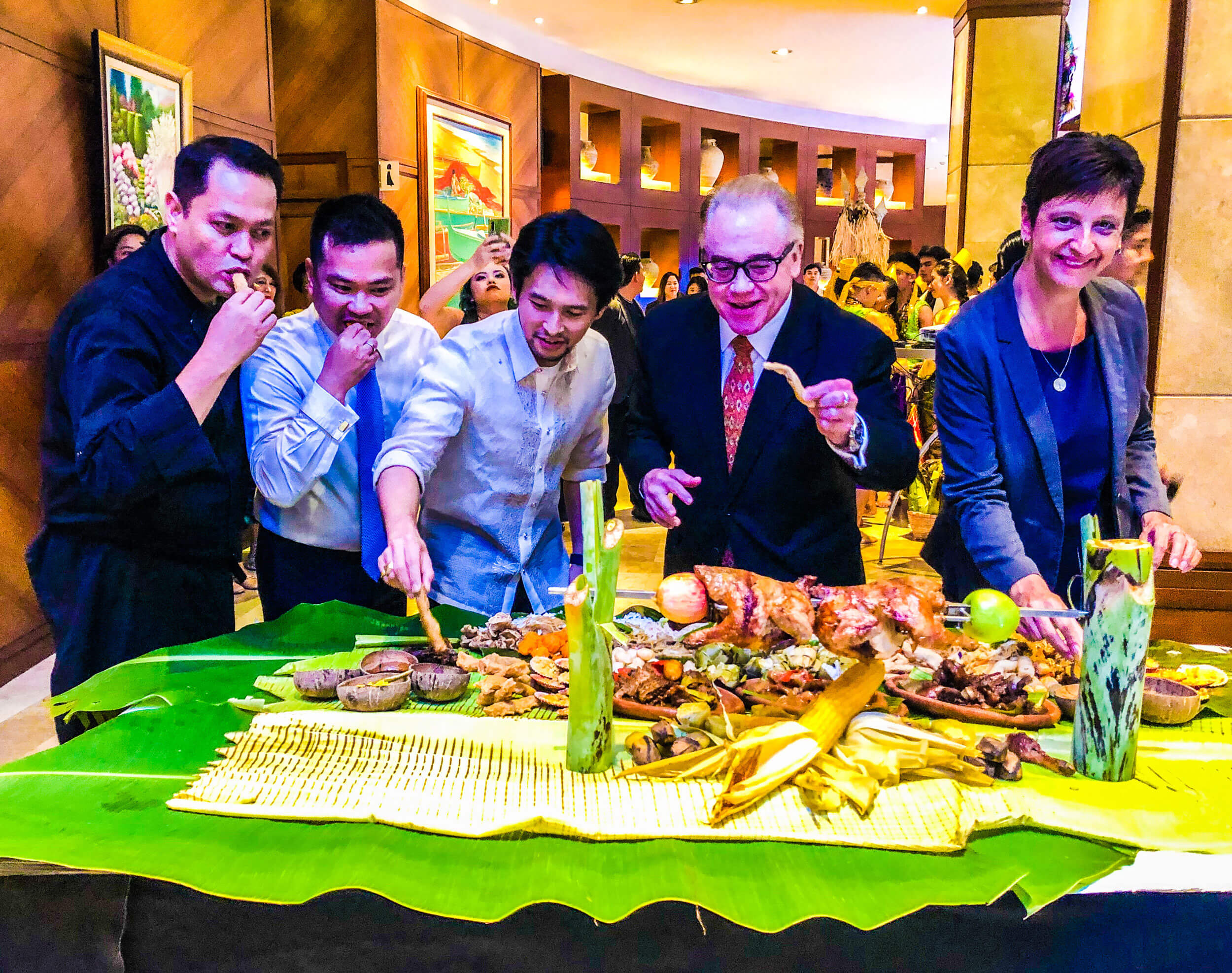 OPENING FEAST. (From left) Marco Polo Plaza Cebu Executive Chef Juanito Abangan; Restaurants, Beverage & Events Director Joward Tongco; Sugbo Mercado Communications Director Michael Karlo Lim; General Manager Brian Connelly; and Resident Manager Michaela Priesner open Sugbusog with a traditional feast of Cebuano dishes.