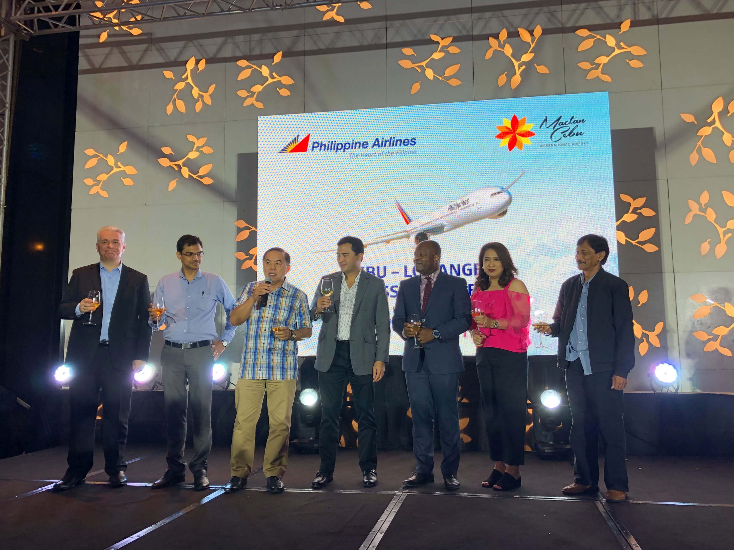 TOAST. PAL officials and guest offer a toast to the success of the Cebu-LA route.