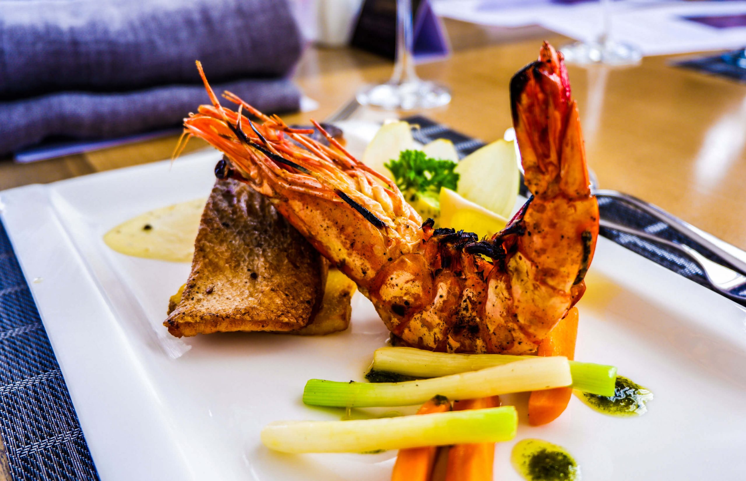 THE LOVE BOAT. Pan seared salmon and prawn combination served with herbed butter and lemon garlic sauce.