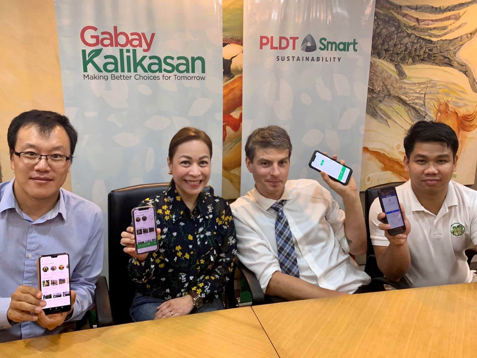 PROTECTING RAINFORESTS. (From left) Daniel Guo Zhi, Huawei Philippines Vice President/COO; Chaye Cabal-Revilla, PLDT SVP & Group Controller and concurrent PLDT Group Chief Sustainability Officer; Topher White, Rainforest Connection CEO; and Brian Lachica, DENR Information Systems Analyst.