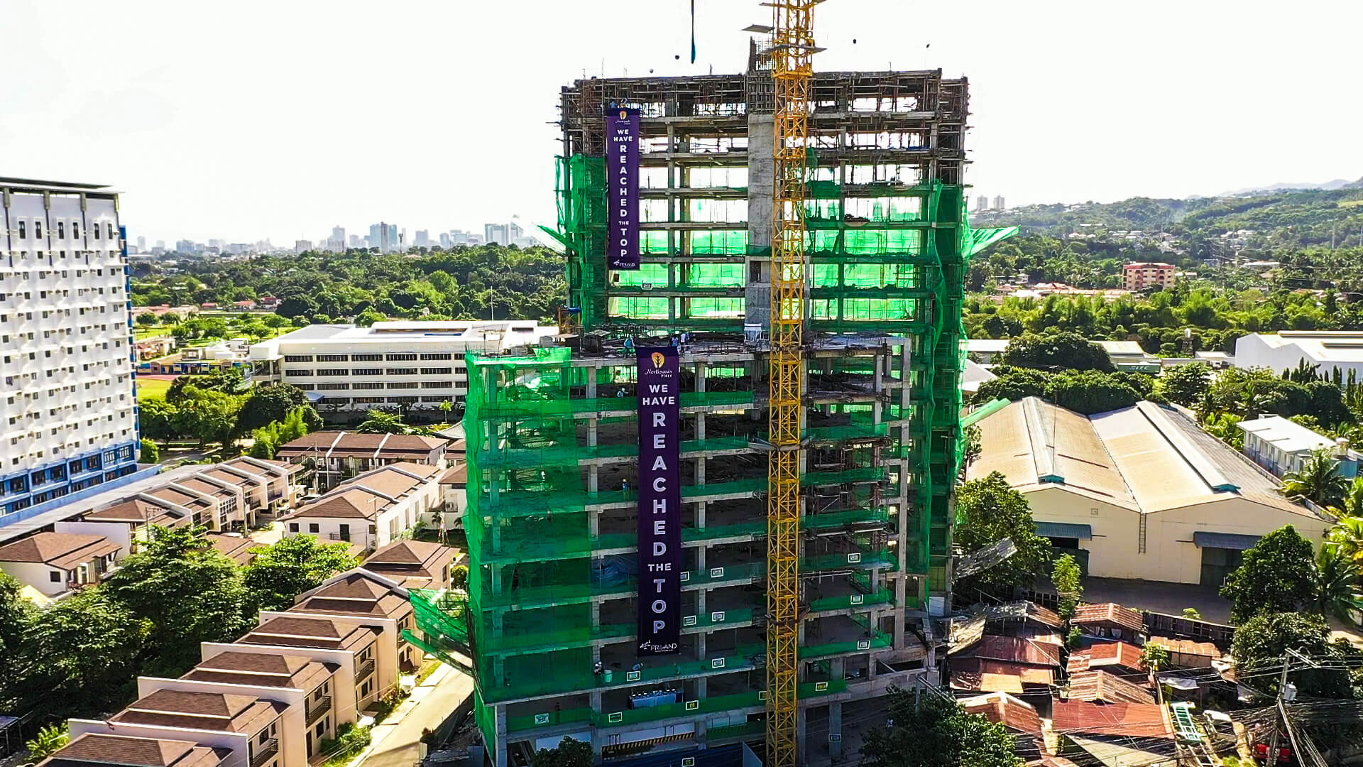 Northwoods Place puts together a purposeful mix of 312 studio, one-bedroom, home office units, and commercial spaces in two towers connected by a bridge.