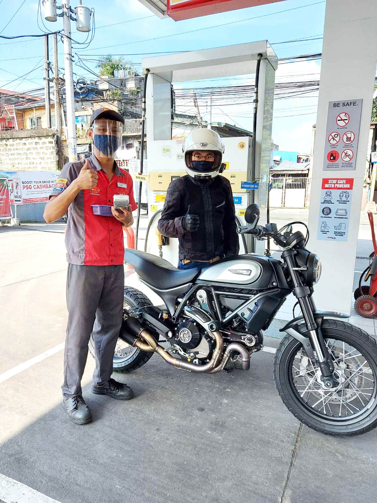 A motorist redeems his discounted fuel voucher at a Phoenix gas station through the Limitless app

