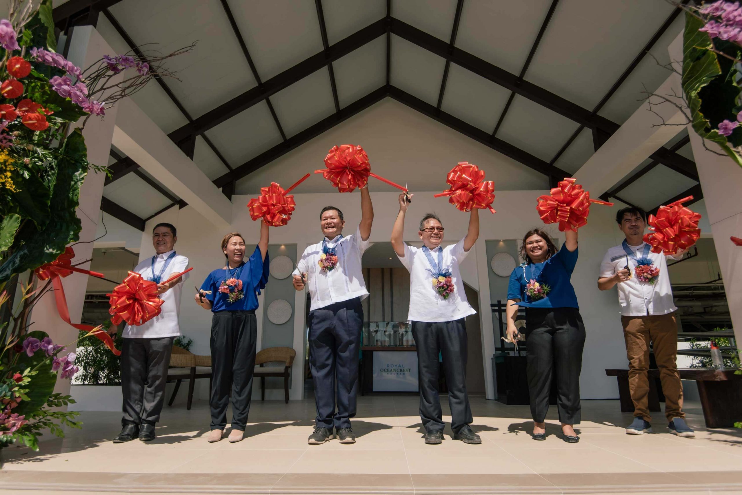 ROYAL OCEANCREST MACTAN SHOWROOM. Cutting the ribbon to mark the opening of the Royal Oceancrest Mactan showroom are (from left) Primary Homes Vice President for Sales and Marketing Ramero Espina, Customer Relations Manager Jenita Sales, Primary Group of Builders Chairman Engineer William Christopher Liu Jr., Primary Homes President Architect Stephen Charles Liu, Marketing Manager Michelle Cutang, and Sales Operation Team Head Francis Icamen.