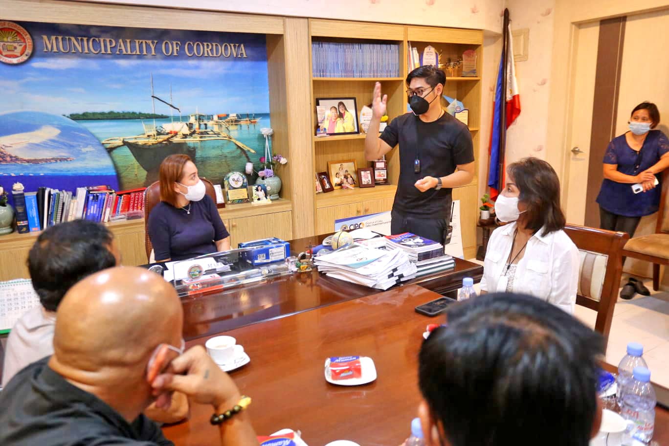 TECH GUY. Eddie Ybañez serves as a consultant of Cebu Governor Gwendolyn Garcia (seated). He is shown here during the turnover of a satellite phone as part of disaster response to Cordova Mayor Mary Therese Sitor Cho. (Photo from the official FB page of Gov. Gwendolyn Garcia.)