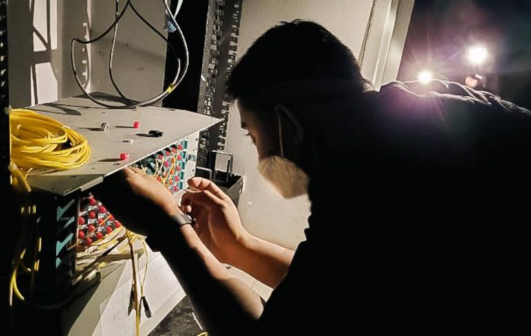 A Smart engineer fixes network equipment in Bohol.