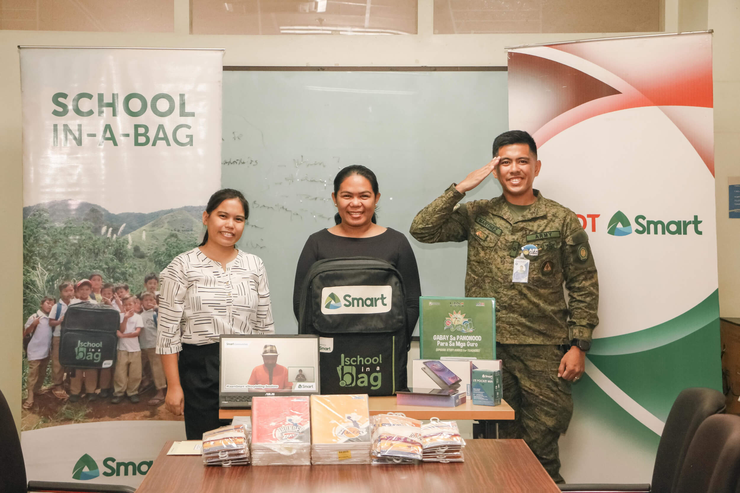 SCHOOL-IN-A-BAG. PLDT Inc. and Smart Communications, Inc. donate a School-in-a-Bag package to the Armed Forces of the Philippines to enhance the learning experience of the Mobile E-Learning Hub’s beneficiaries. In the photo are (from left) Tiarra Cabilla, Smart Stakeholder Management Officer; Marylou Gocotano, PLDT and Smart Stakeholder Management Visayas Relations Head; and Maj Joe Patrick A. Martinez PA, Group Commander of the 3rd Civil Relations Group, CRSAFP and Mobile E-Learning Hub Project Officer.