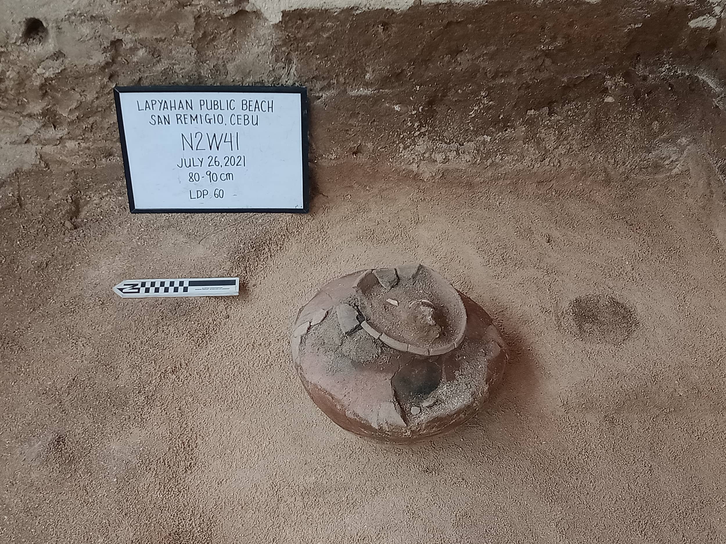 BURIAL JAR. This jar was found at the Lapyahan public beach dig site. When part of the contents were removed for sampling, the team found remnants of a human child and two shell bracelets. (Photo provided by the Northern Cebu Archaeological Project.)