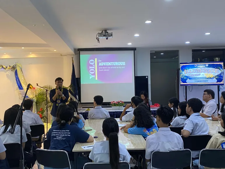 Josel Bautista, Aboitiz Future Leaders scholar and DLSU summa cum laude graduate, speaks to high school students